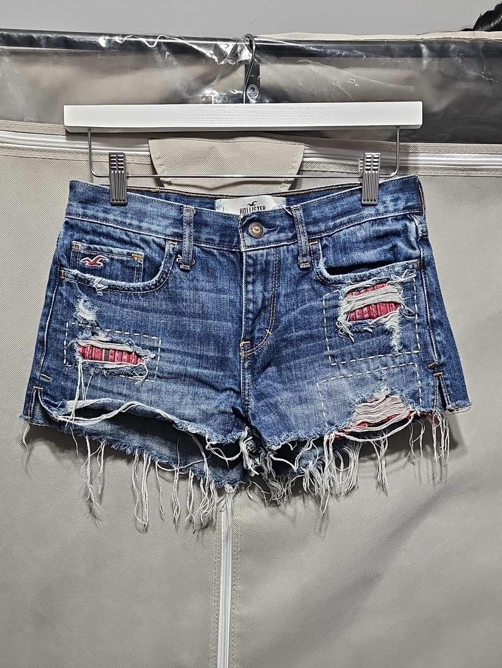 Hollister Distressed Blue Denim Shorts with Pink Patch Detail